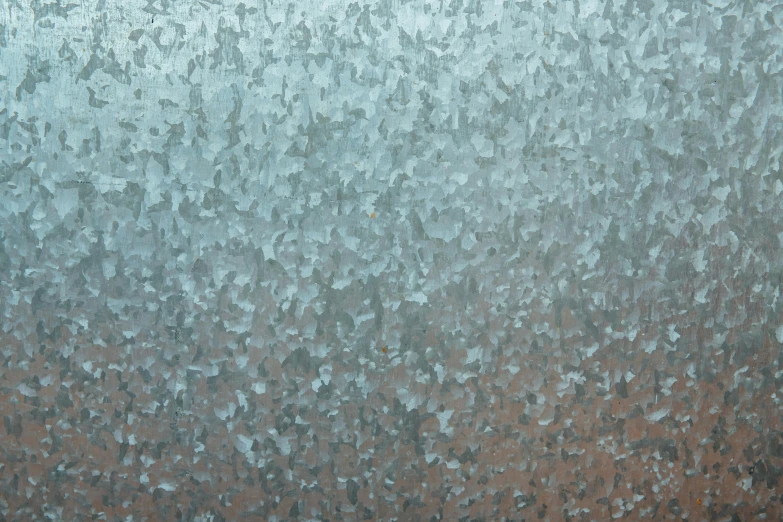 very large window covered in water drops on a cloudy day