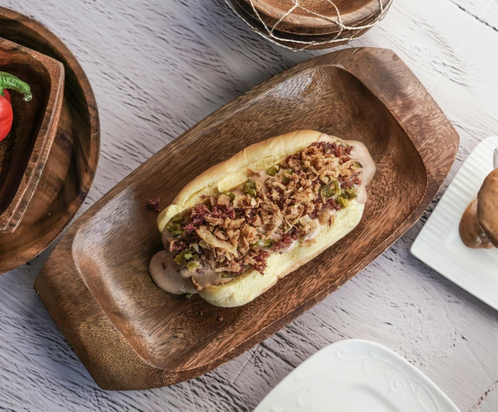 a  dog on a plate next to other food