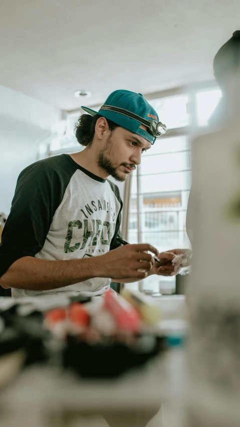 man in an open kitchen with food items