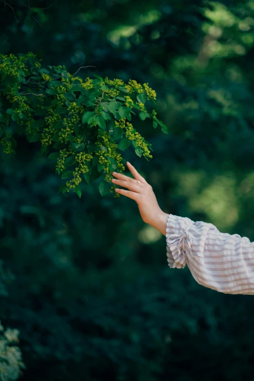 a woman that is holding some kind of green item