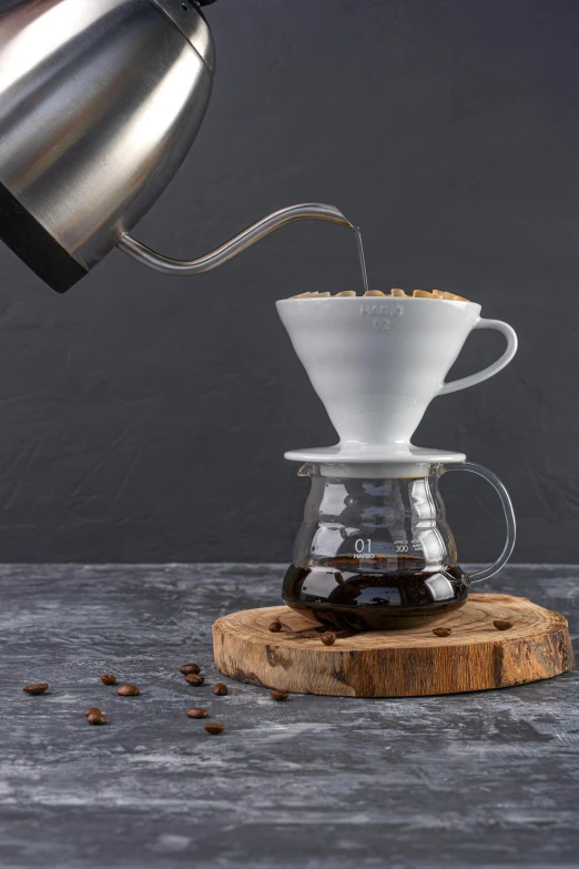 pouro pot pouring coffee into a wooden slab