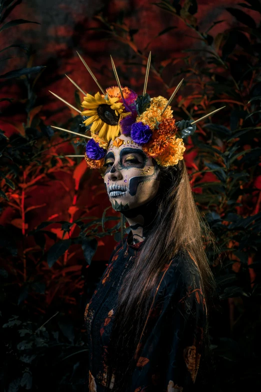 a person with fake flowers painted on her face