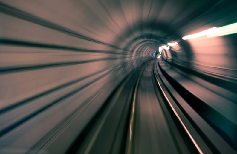 blurred subway train in tunnel view through windshield