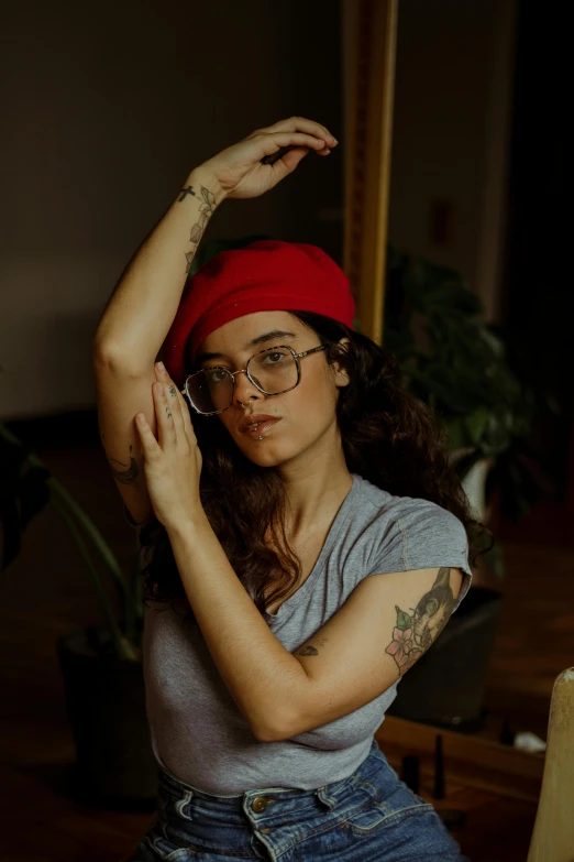 a woman holding a knife and posing for a camera