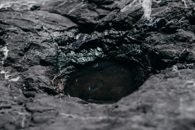 some rock and dirt and an object in the ground