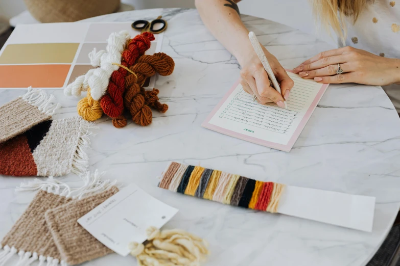 a person doing crafting with some yarn