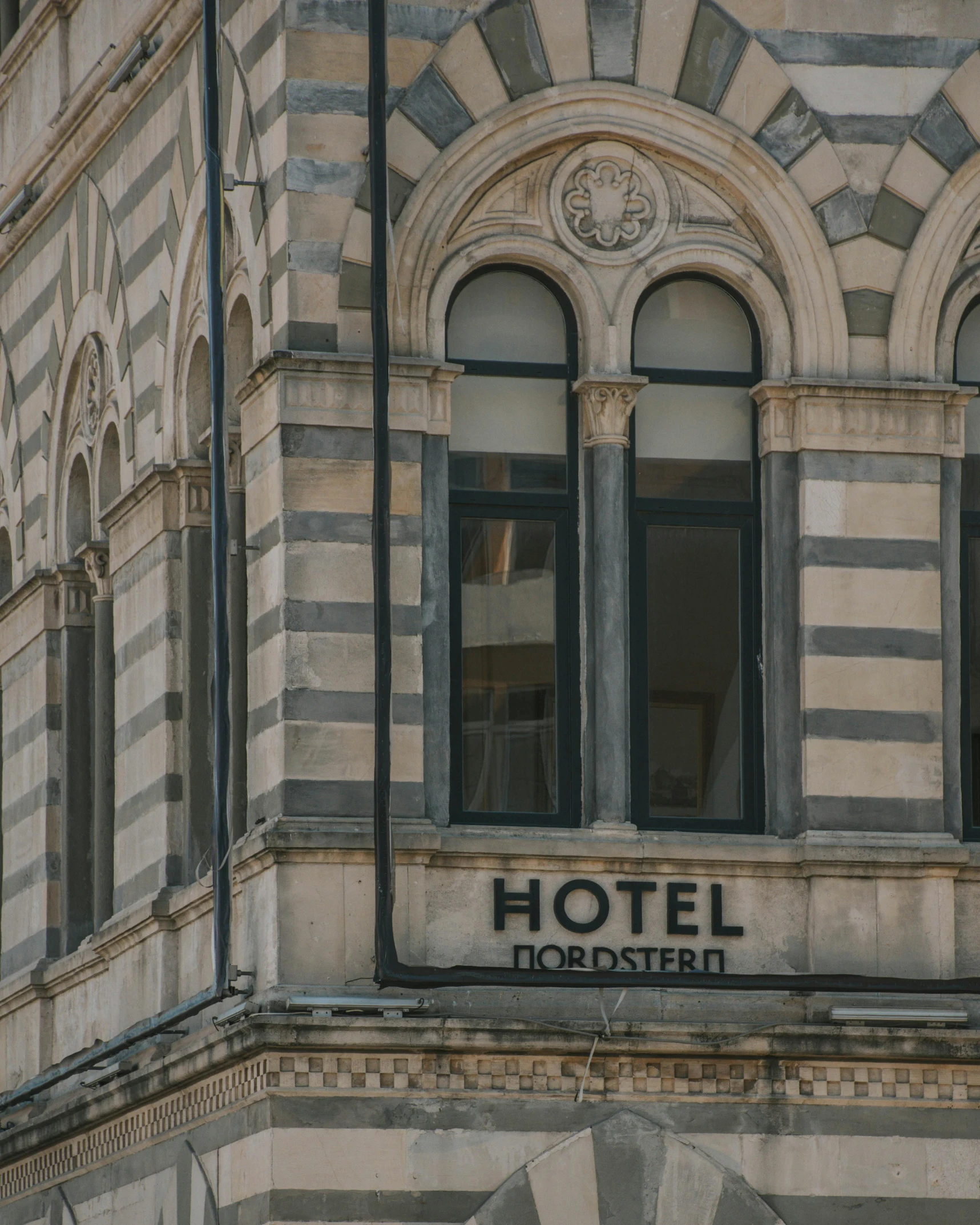 the logo is written on the front and side of a building