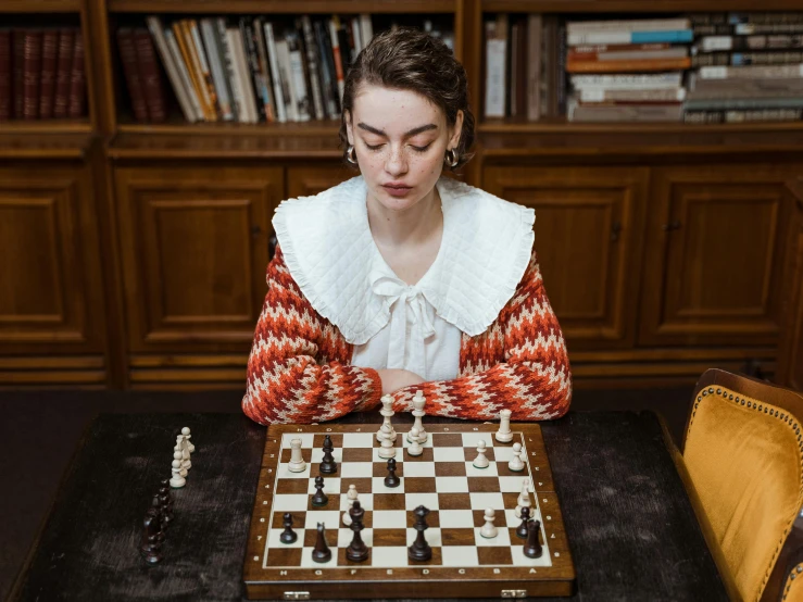 an image of a woman playing a game of chess