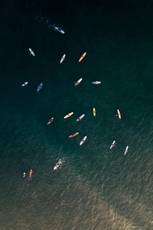 a bunch of boats in the water with some people in them