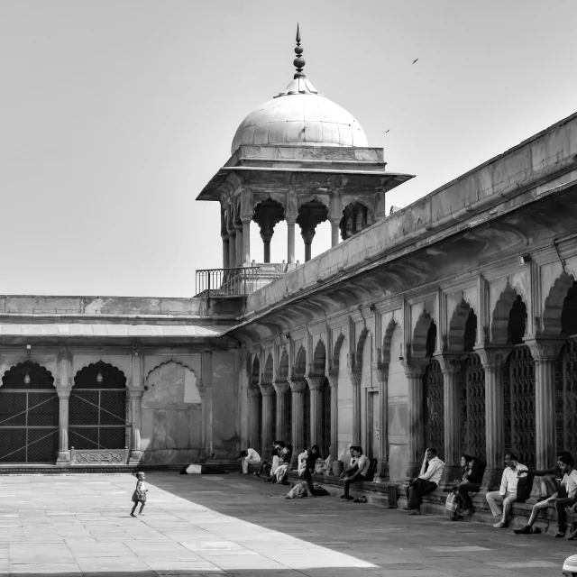 an image of a person sitting on some benches