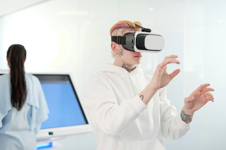 a woman in white jacket using a virtual reality headset