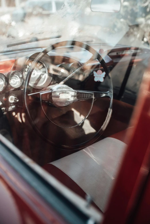 a po looking at the inside of a classic car