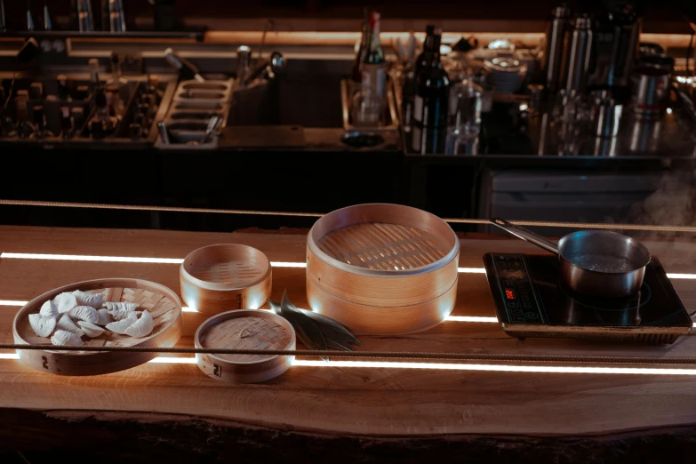 a table with some wooden bowls of food on it