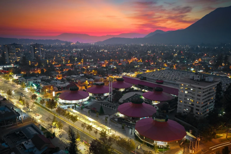 an aerial view of some buildings at sunset