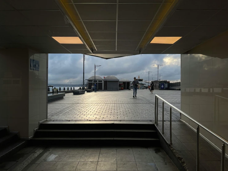 stairs are shown between two windows at an outdoor entrance