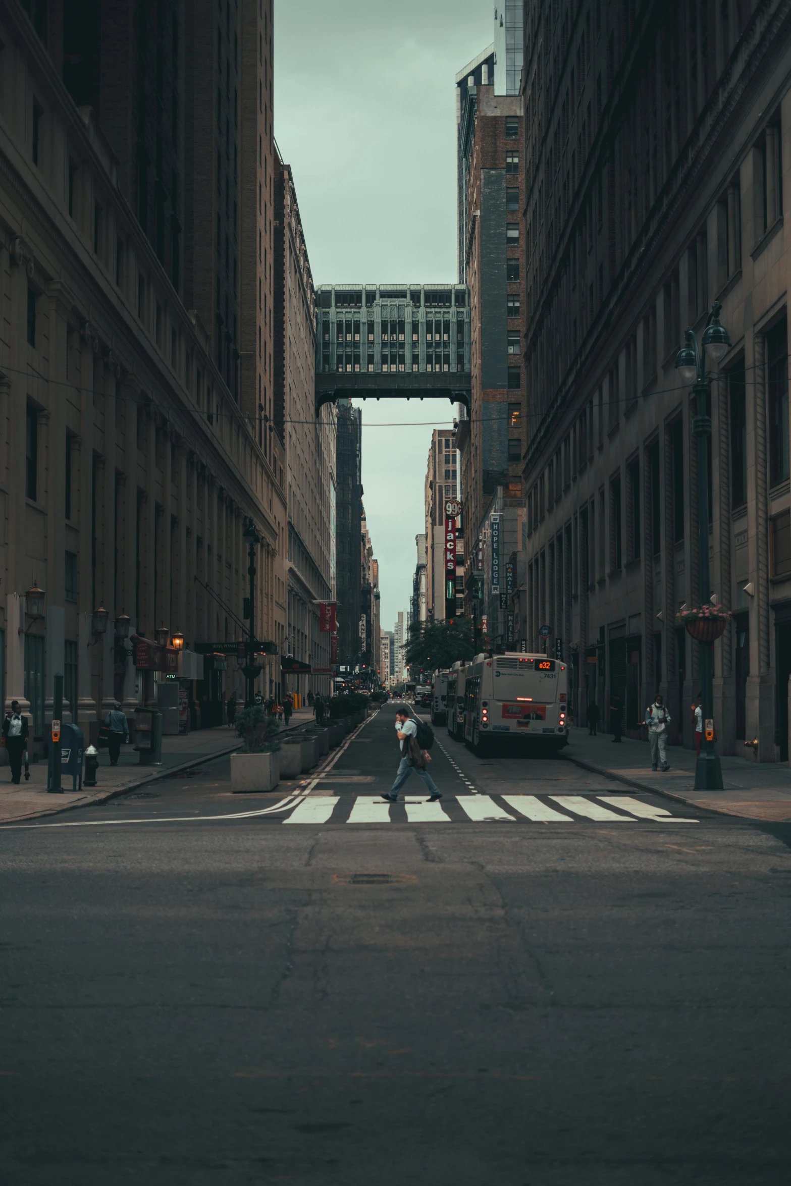 a busy city street filled with traffic surrounded by tall buildings