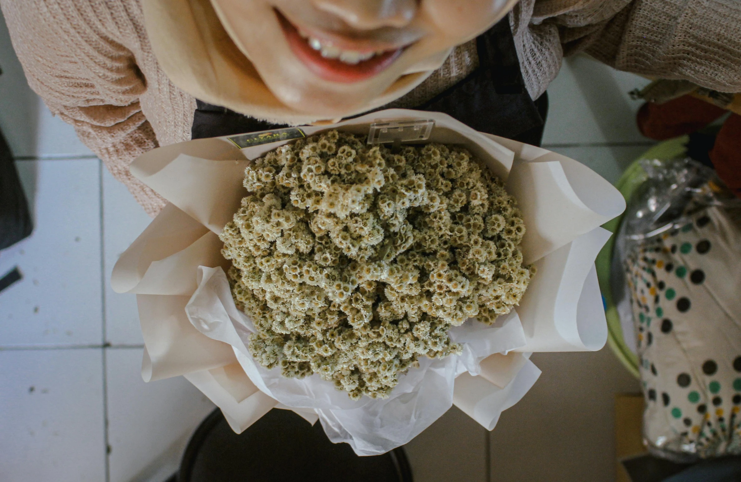 a person holding a tray with some kind of object