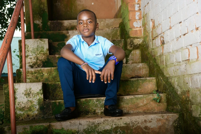 a man is sitting on the steps outside