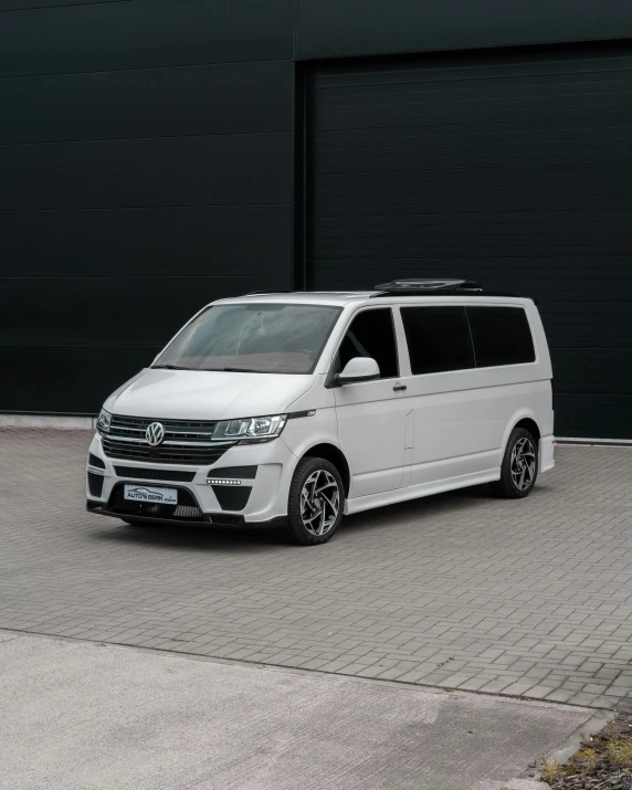 a white van is parked outside of a building