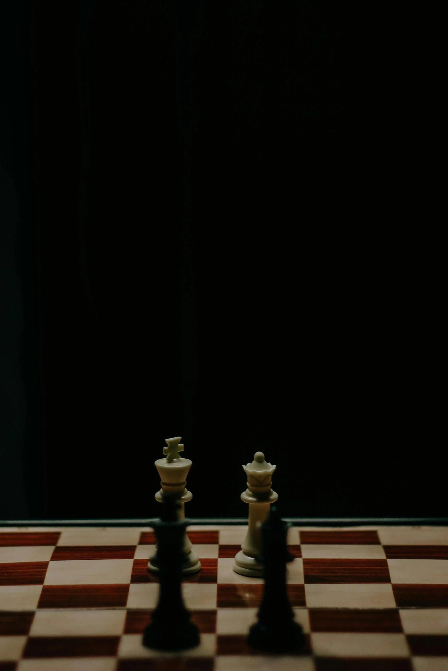 two chess pieces with one moving along the opposite side