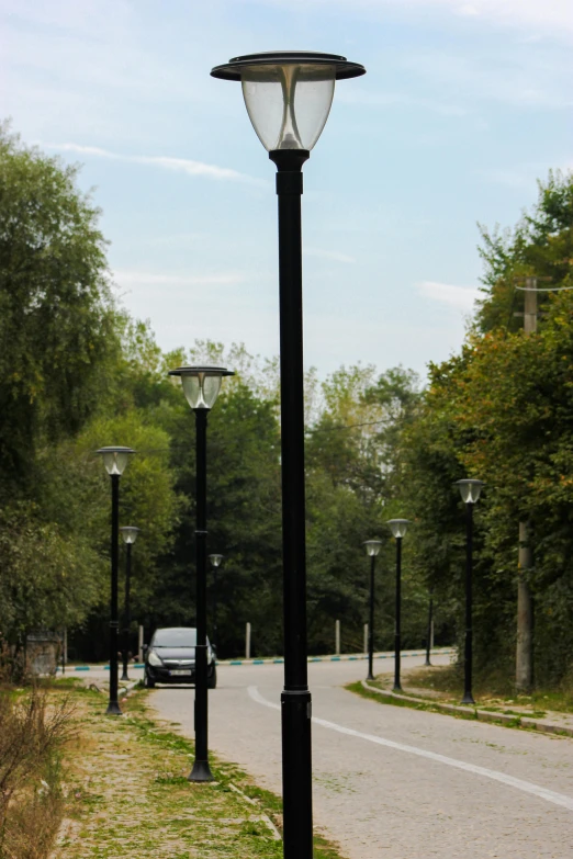 a lamp post on the side of a street