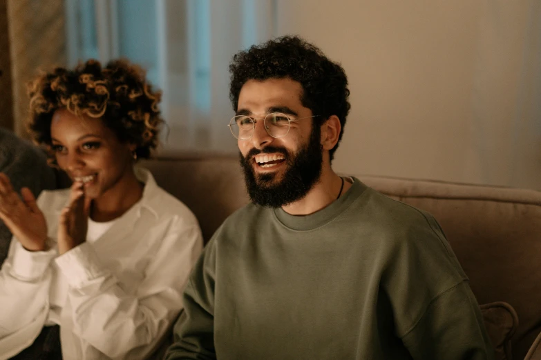 two men and women sitting next to each other