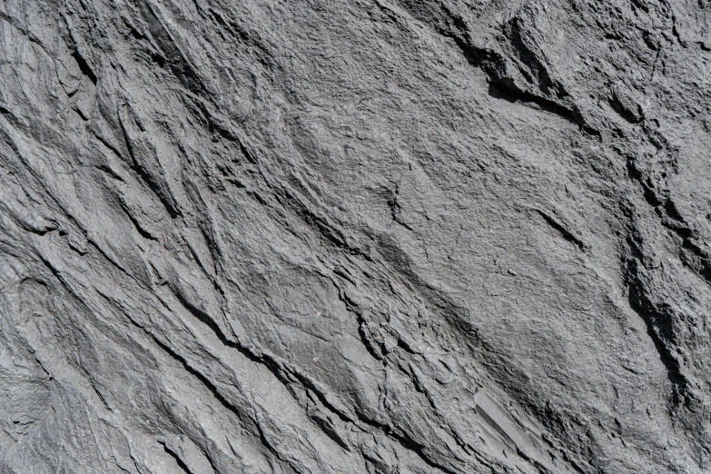 grey surface, including a wavy line of stone