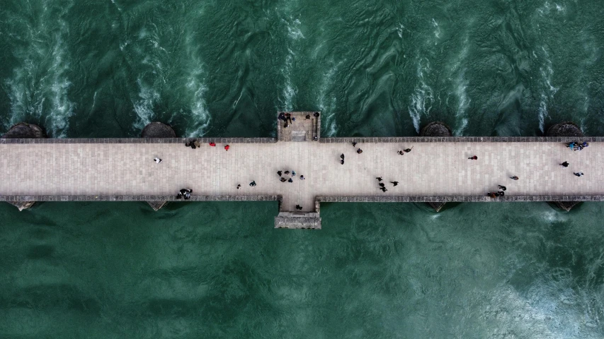 aerial view of a wooden pier in the ocean