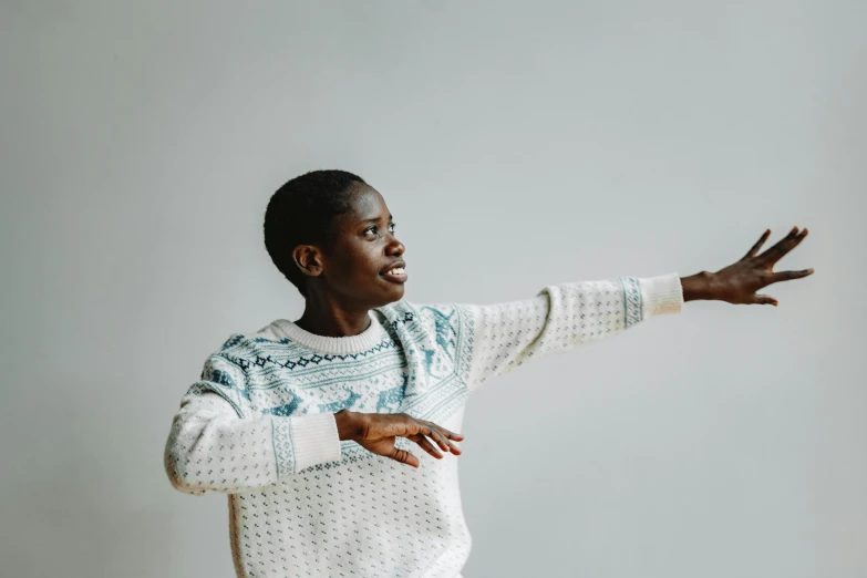 a man is standing with his arm outstretched