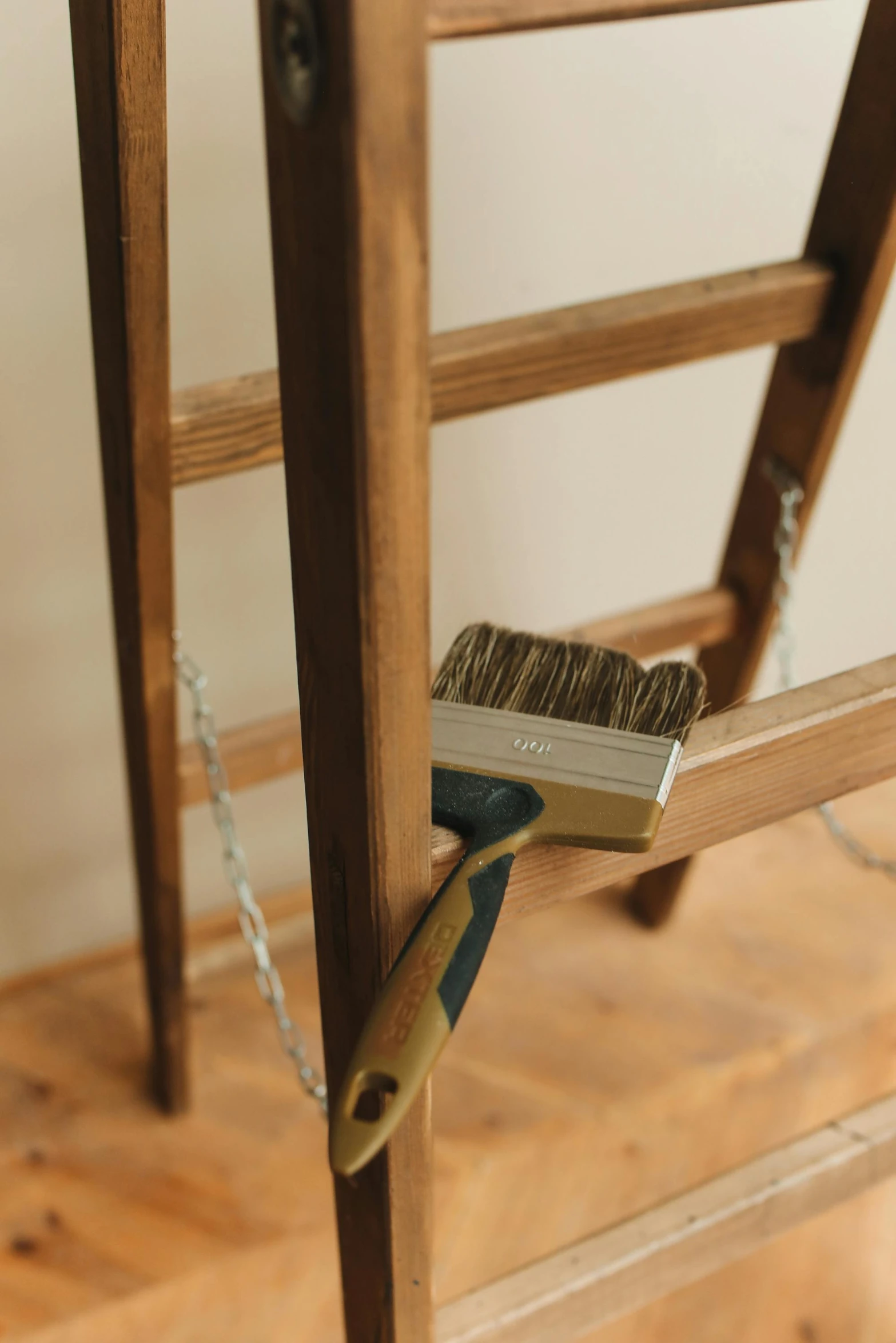 a brush and razor on wooden planks with a rope