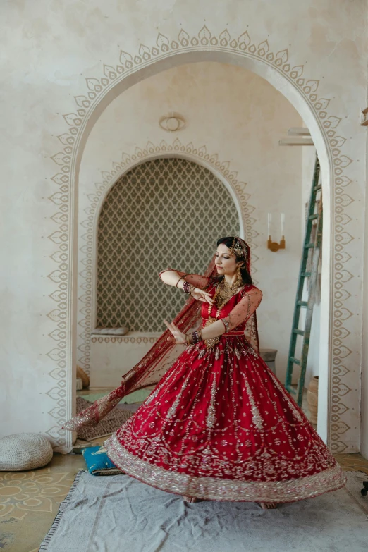 a woman in a dress, is dressed in red