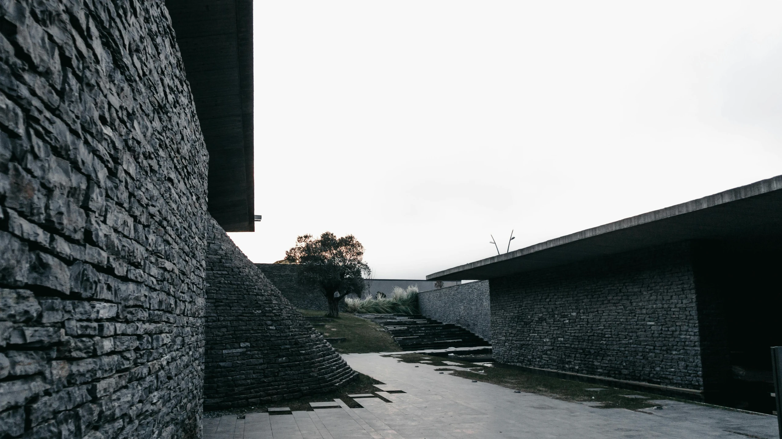 an overpass and walkway leading up to some buildings