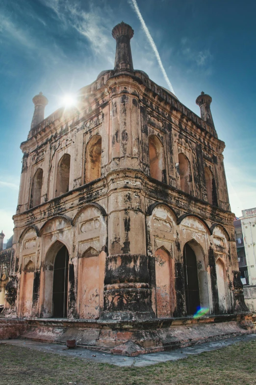 this old building has an ornate archway, dome and window