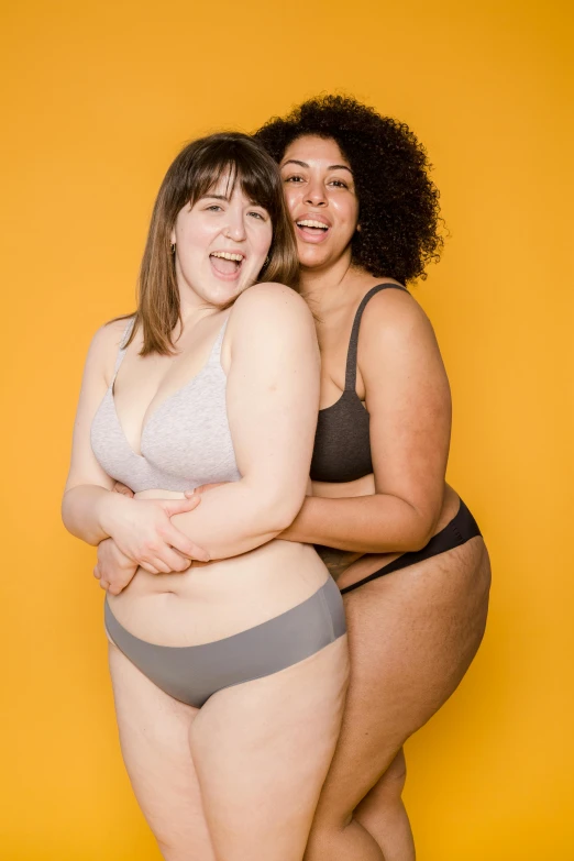 two women are posing for the camera together