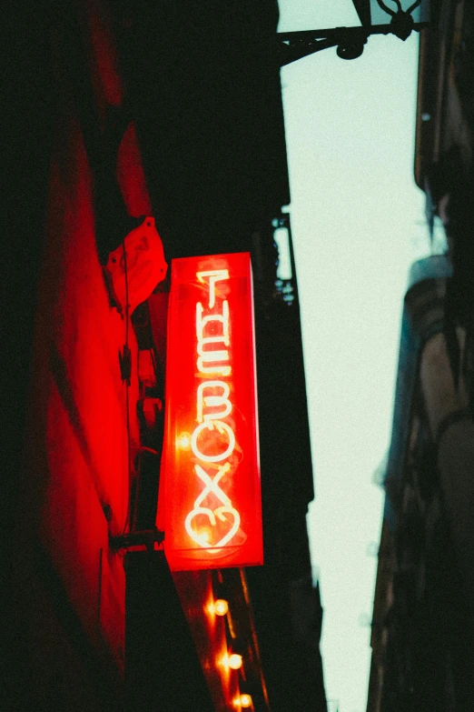 a restaurant sign and a building with no one visible in the picture