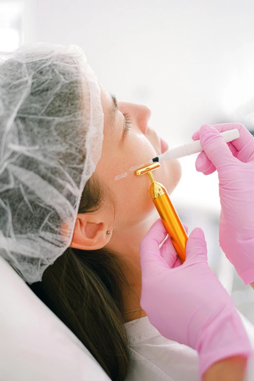 an image of a woman getting her teeth brushed