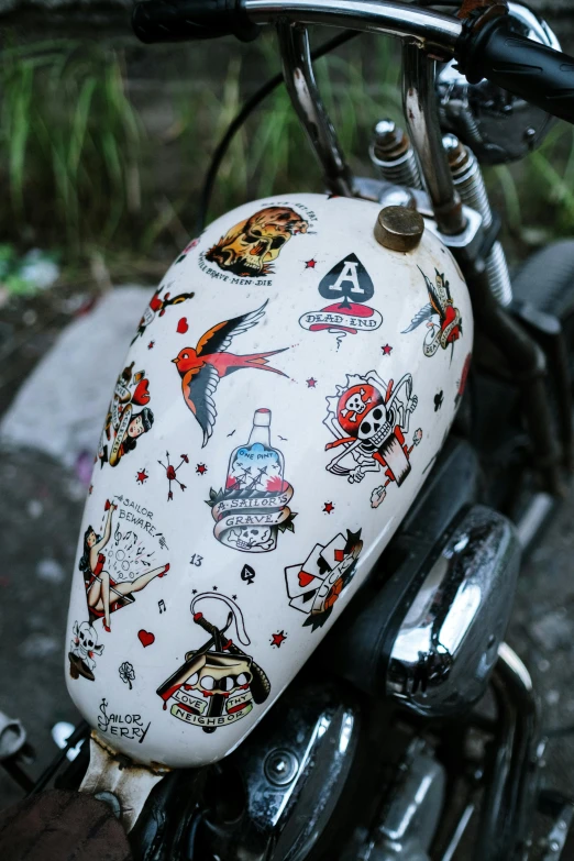 motorcycle saddle with a helmet cover covered with many different tattoo designs