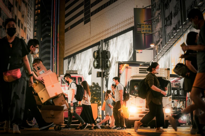 a crowd of people walking down a street