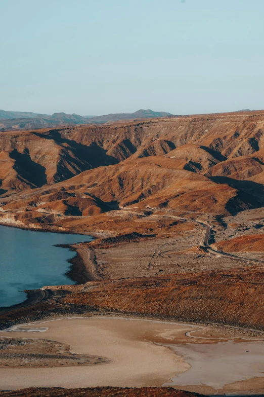 a large body of water surrounded by hills