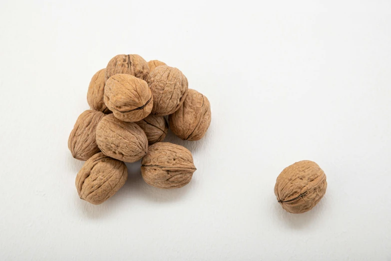 a group of nuts sitting on top of a white counter