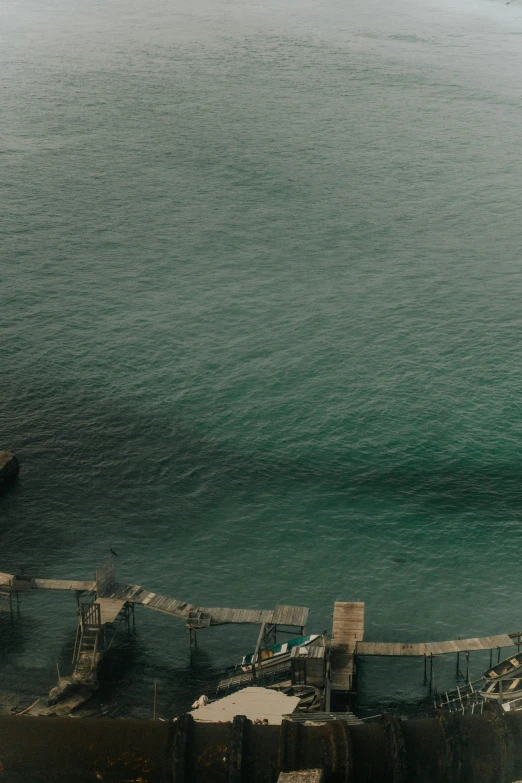 a boat out on the water in front of a pier