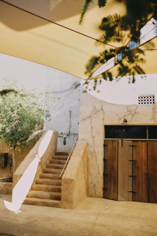 an outdoor shower with stairs leading to it