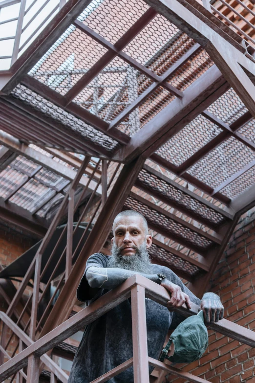 a man standing at the top of a set of stairs