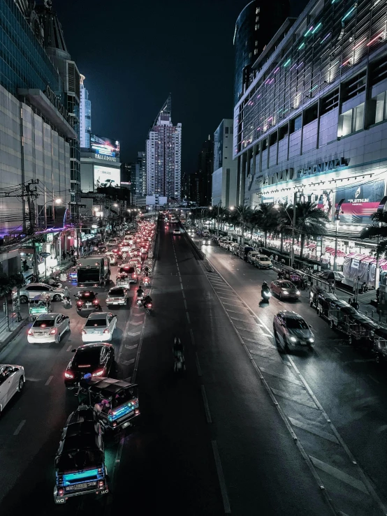 a large street filled with lots of traffic and tall buildings