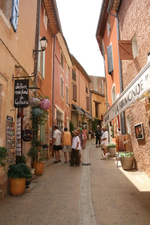 people are walking down the street in old town