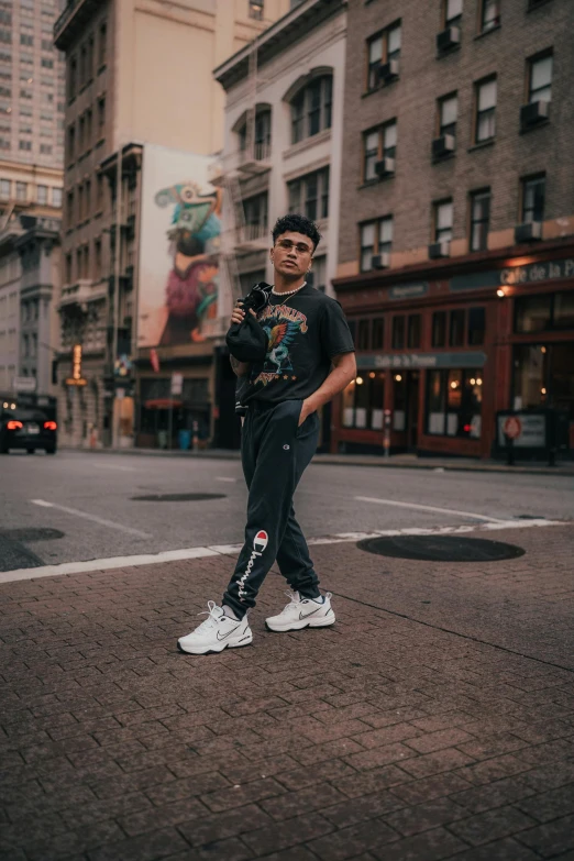 a man poses for a picture in the street