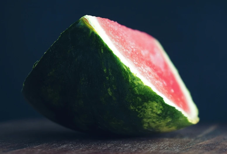 one piece of a watermelon fruit still on the counter