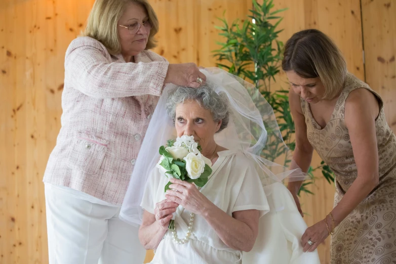 the woman is getting ready for her wedding