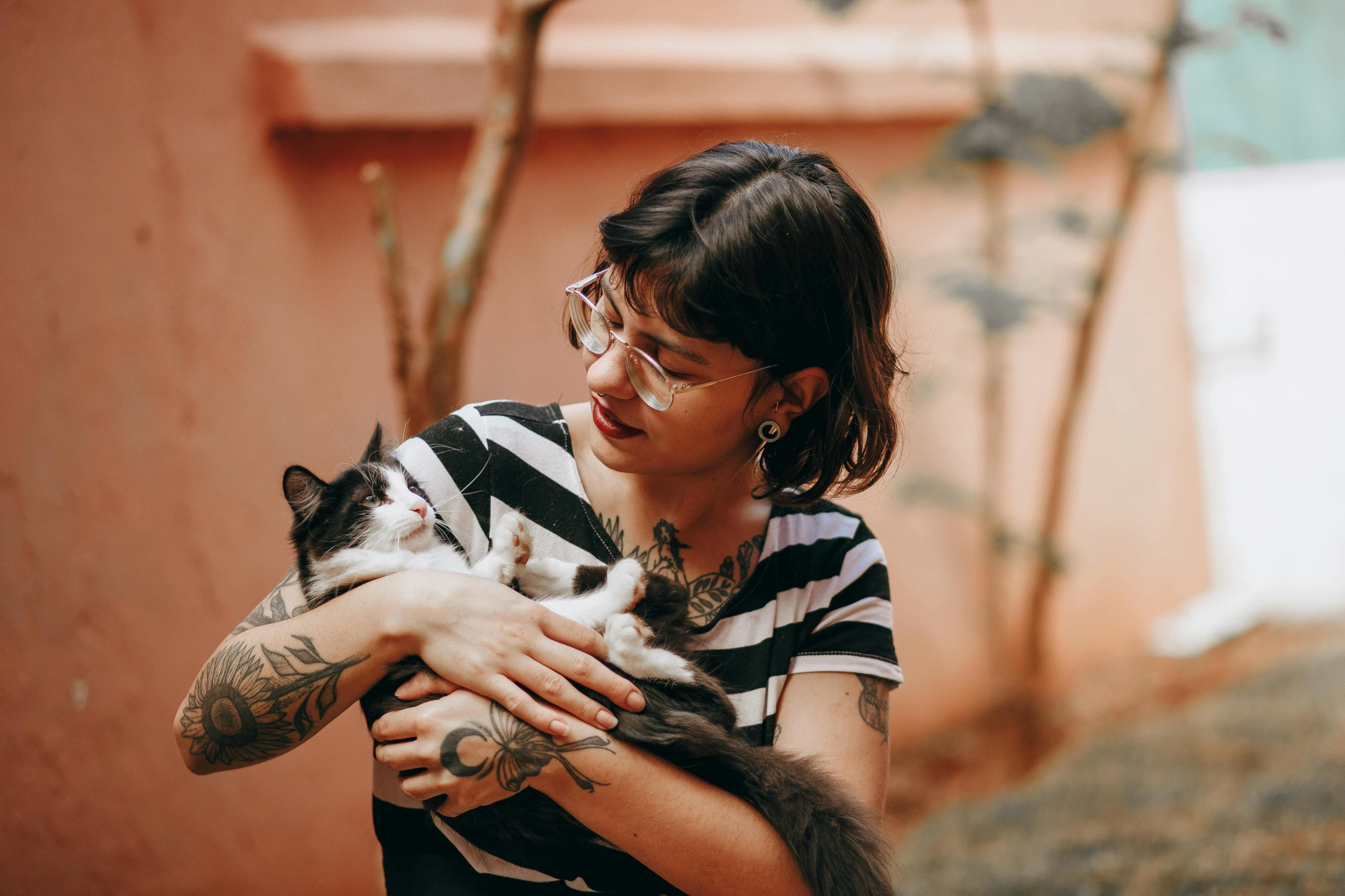 an image of a woman holding a cat