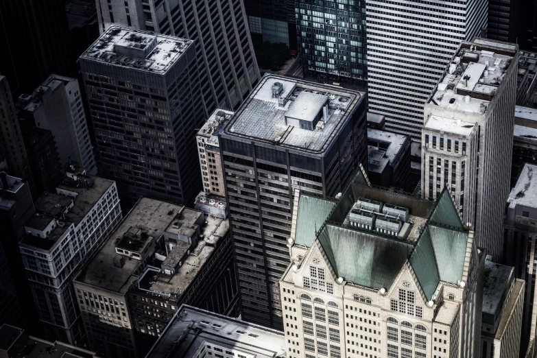 an aerial view of the cityscape showing buildings and tall skyscrs